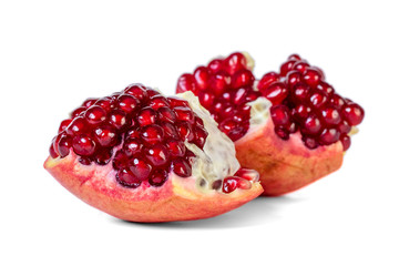 Ripe pomegranate fruit with seeds isolated on white