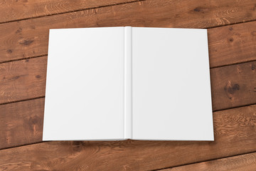 Blank white vertical open and upside down book cover on wooden boards isolated with clipping path around cover. 3d illustration