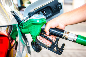 Refueling the car on the pump station .