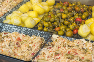 All sorts of pickled vegetables on display at a street food market