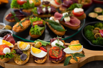 Many kinds of appetizer on the black table