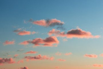 orange clouds in the light of raspberry sunset
