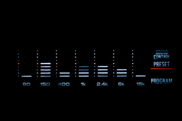 Old stereo graphic volume equalizer glowing in the dark.