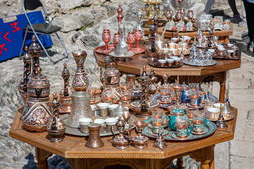 Mostar, Bosnia and Herzegovina - April, 2019: Mostar old town. Tables with decorative souvernirs at the market.