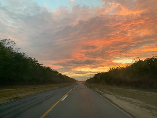 Endless road in Cuba, sunset