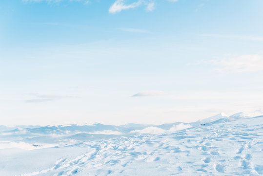 Scenic view of snowy mountain with traces and pure blue sky