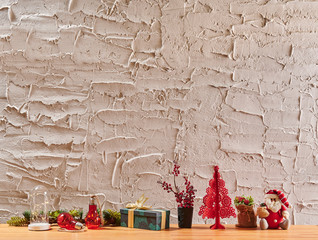 Decorative textured grey stone wall, wooden desk and frame, home ornament detail.