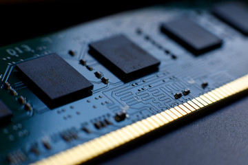 Contacts, connecting tracks and microchips of a computer RAM Random Access Memory modules close-up for electronic design. Selective focus. - obrazy, fototapety, plakaty