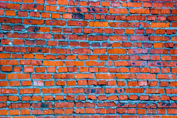 Fototapeta premium burnt brick brick wall.