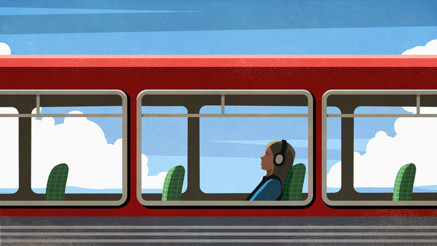 Female commuter relaxing, listening to music with headphones on bus