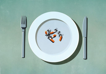 Cigarette butts on plate