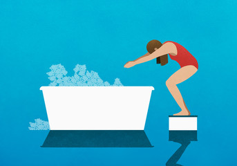 Woman on diving block preparing to dive into bubble bath