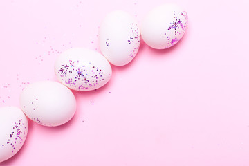 fresh white farm easter egg on pink/blue background. cooking/festive easter concept flat lay with copy space