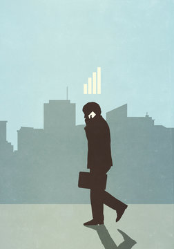 Cellular reception bars above businessman talking on smart phone in city