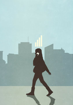 Cellular reception bars above businesswoman walking and talking on smart phone in city
