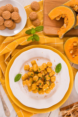 Pumpkin gnocchi with grated amaretti cookies.