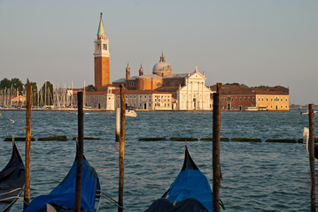 Venice, Italy: traditional Gondola on Canal Grande with San Giorgio Maggiore church in the background, San Marco