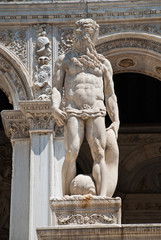 Fototapeta premium Venice, Italy: A statue of Neptune - the Roman God of the Sea, located at the Giants Staircase at the Doges Palace (Palazzo Ducale). The statue represents Venice’s power by sea