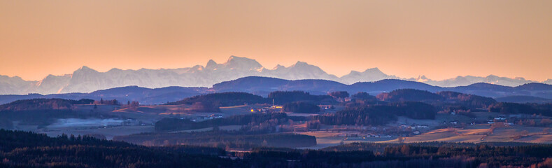 sunrise in mountains - landscape with mountains on horizon, clean yellow and orange sky