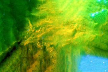 Light green nebula in deep space. Background texture. Elements of this image were furnished by NASA.