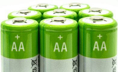 green batteries on white background