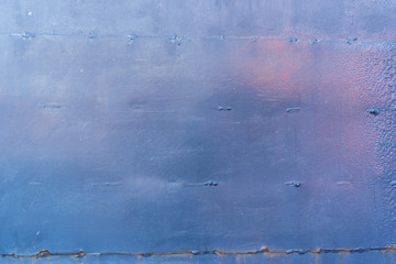Abstract background. Blue painted grunge metal wall
