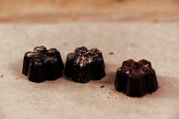 gold powder on tasty prepared chocolate candies