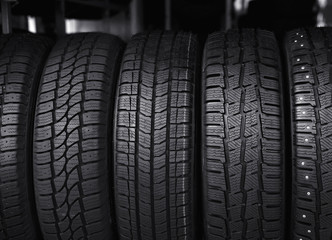 Black car tires in service store, closeup
