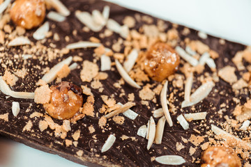 close up of delicious chocolate bar with hazelnuts