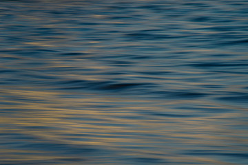 Soothing silky flowing natural ocean water movement at sunset