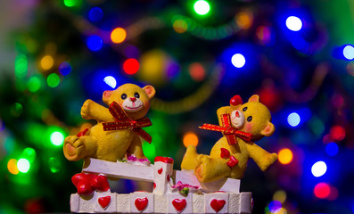 teddy bears in love on a swing in focus