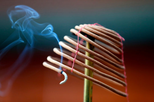 Burning spiral incense sticks in Taoist ceremony, Mau Son Taoist temple, Sapa, Vietnam
