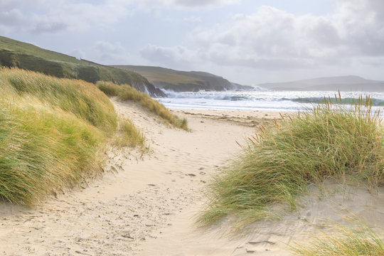 Fine white sand shell tombolo, dunes and grasses, beach, crashing waves, St. Ninian's Isle, Mainland, Shetland Isles, Scotland