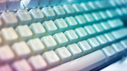 Obraz premium closeup on a modern keyboard with shallow depth of field and tones colors for the concept of applying online forms or coding and any data entry computing work