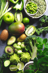 Variety of Green Vegetables and Fruits on the grey background