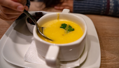 Cheese cream soup on the table in the cafe