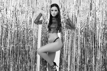 Obraz premium Elegant hispanic brunette woman with perfect body in luxurious sequin top
