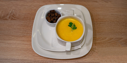 Cheese cream soup on the table in the cafe