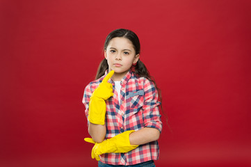 So fresh and so clean. Thoughtful child wear rubber gloves red background. Household work. Housekeeping routine. Cleaning service. Cleaning and sanitation. Clean up. Keep home clean. House clean