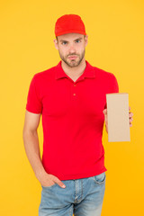 Performance on time worldwide. Smooth transition. Courier delivery. Postman worker. Man red cap yellow background. Transportation agency. Transportation goods. Transportation concept. Transporting