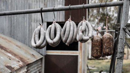 Handmade pork sausages, hung drying in fresh air