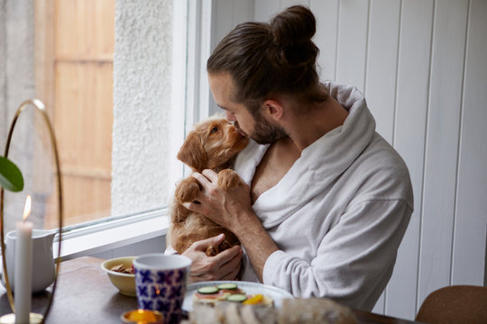 Man holding puppy