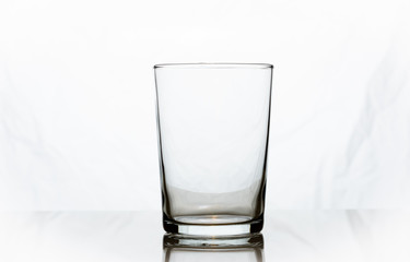 An empty glass against white background.