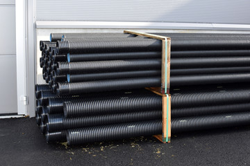 Sewer pipes as a product in at a warehouse of a construction store.