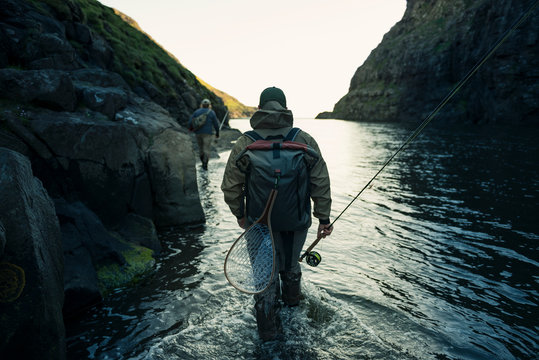 Man walking through river