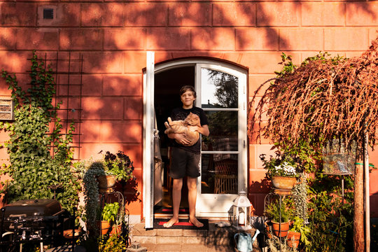 Boy holding cat
