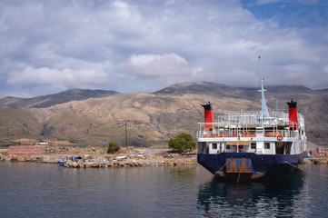 Ferry boat in Old Port in Kissamos town on a Greek Island of Crete, Greece