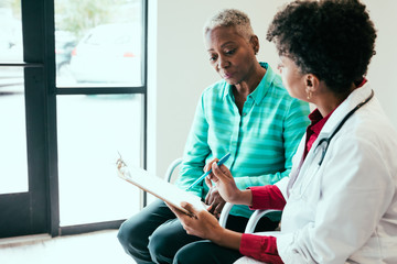Patient reviewing chart with doctor