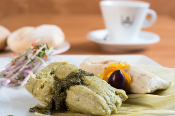 Peruvian food, tamales verdes. Fresh corn and coriander leaves are the basis of these delicious homemade green tamales.