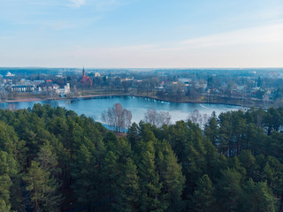 Fototapeta na wymiar Aerial beautiful panoramic image of Druskininkai cityscape over Druskonis lake during early spring daytime.